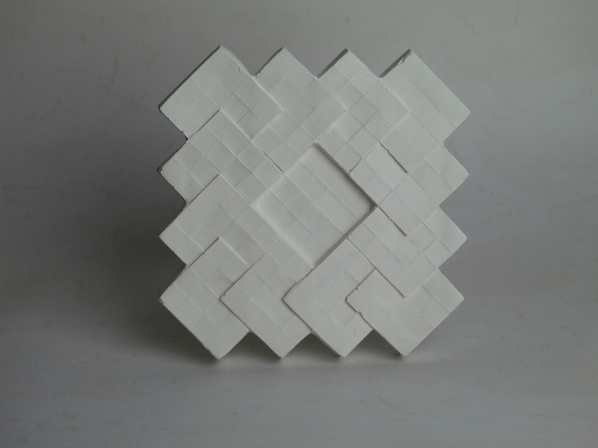 Raw plaster tile.