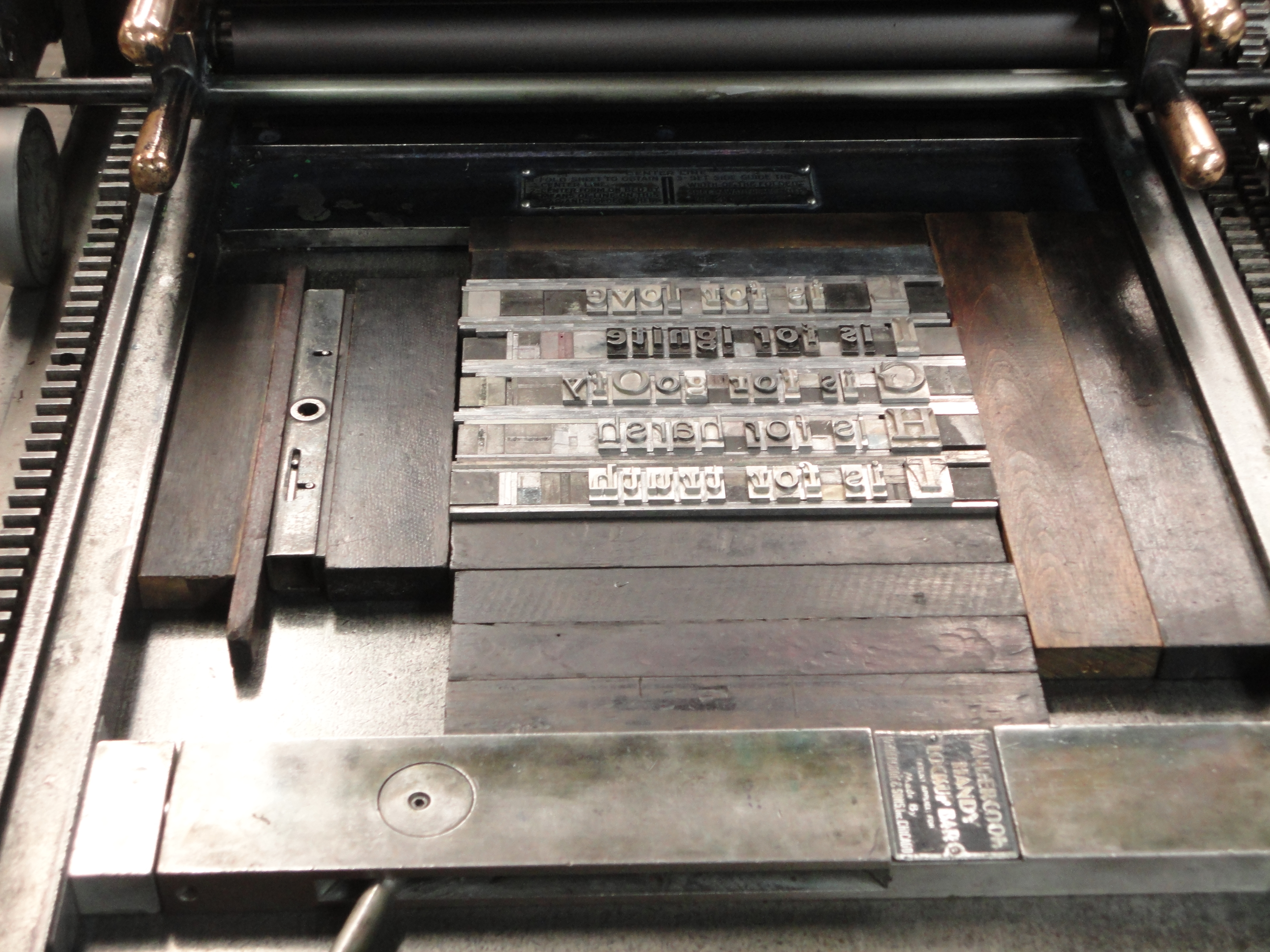 Setting the type on the press bed.